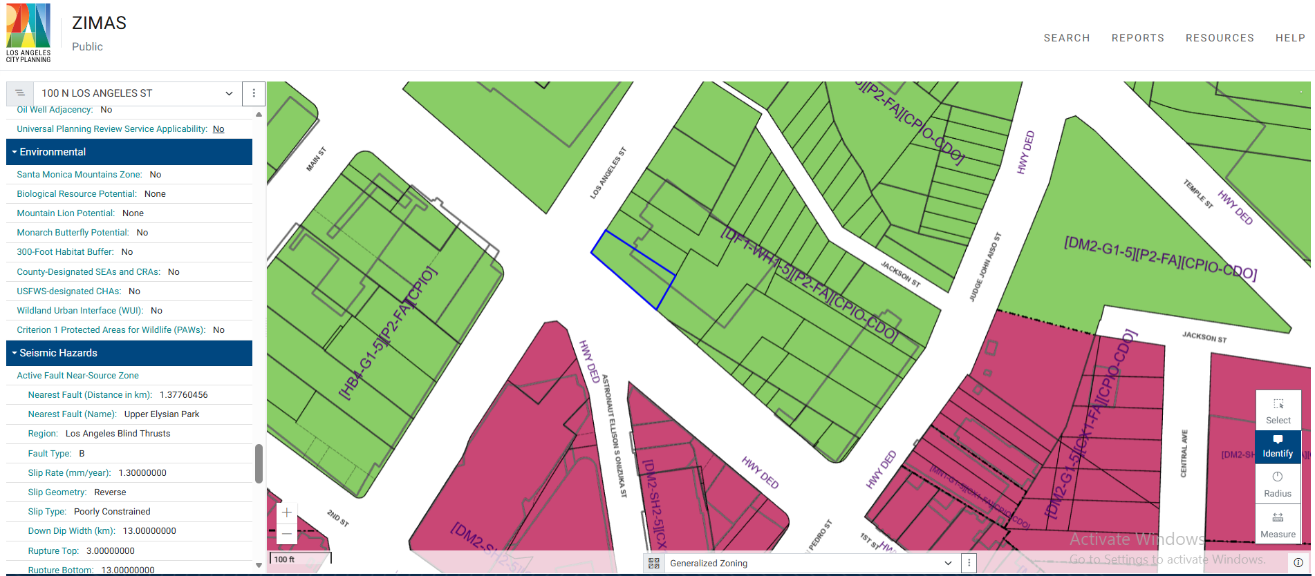 ZIMAS interface for 100 N Los Angeles St, Downtown LA. Environmental section shows nine screening criteria including biological resources, wildlife habitat, and wildland urban interface — all returning No or None for this Downtown parcel. Seismic Hazards section shows nearest fault name Upper Elysian Park at 1.38 km, fault type B, slip rate 1.30 mm per year, reverse slip geometry, poorly constrained slip type, down dip width 13 km, rupture top 3.0 and rupture bottom 13.0. The map shows color-coded zoning parcels with designations including DF1-WH1-5, P2-FA, and CPIO-CDO visible on surrounding blocks.