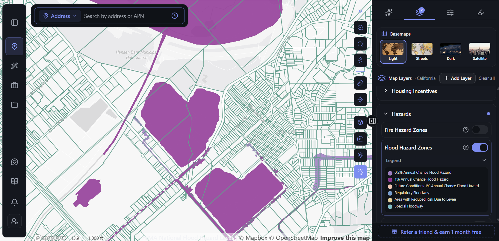 ArchiWise Flood Hazard Zones layer showing FEMA-mapped flood hazard areas around Hansen Dam near Pacoima and along drainage channels between residential blocks in the San Fernando Valley, Los Angeles